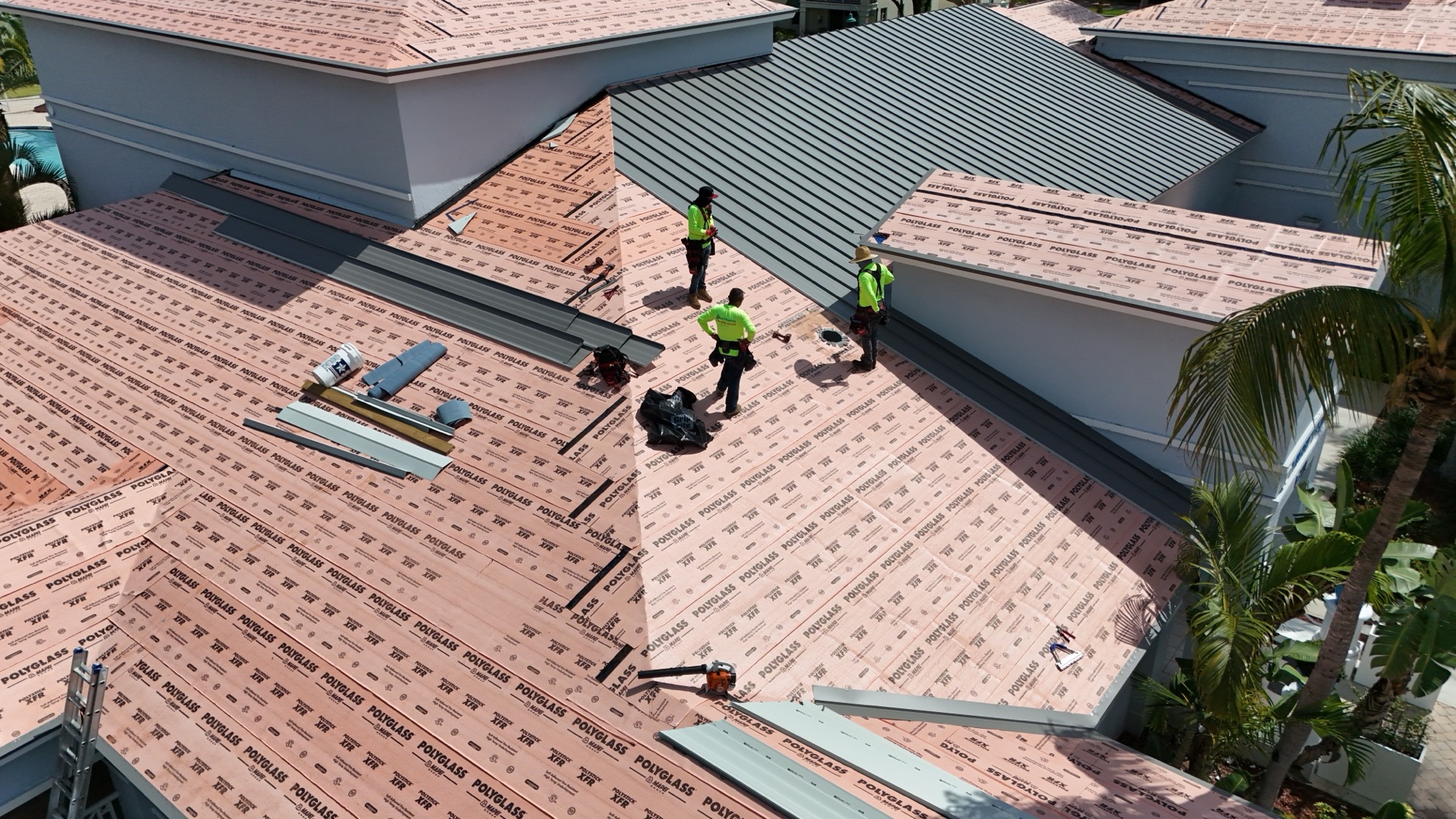 AJF crew installing underlayment on a residential roof, South Florida